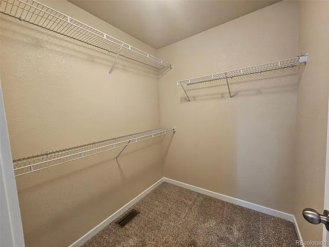 a view of a room with racks on the wall