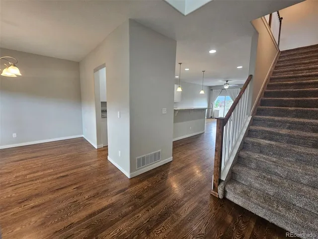 a view of entryway with wooden floor