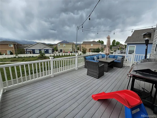 a view of a balcony with furniture