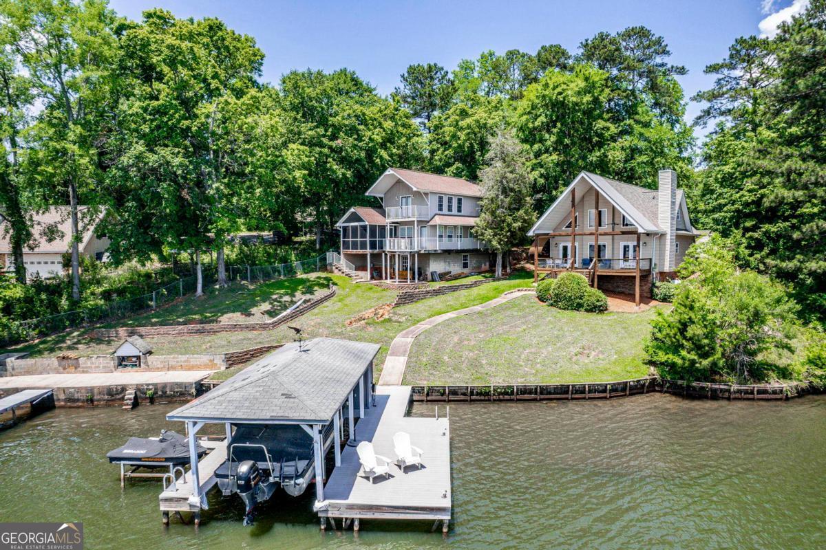 172 Mays Road Milledgeville, GA 31061 - Photo 45 of 54 an aerial view of a house with swimming pool garden and lake view