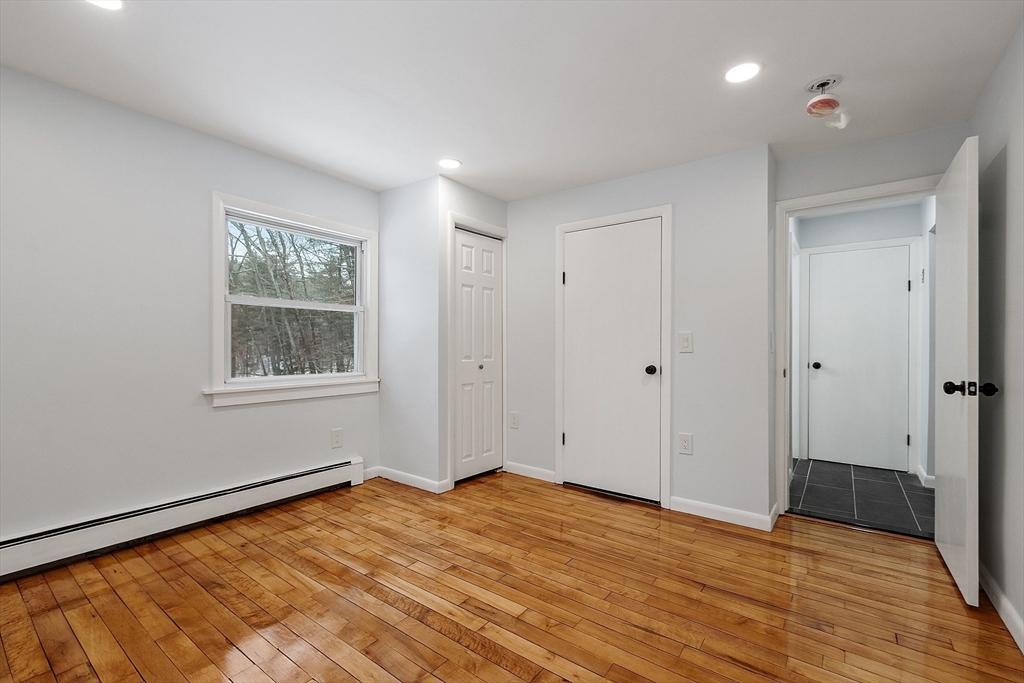 10 Townsend Road Shirley, MA 01464 - Photo 13 of 38 a view of empty room with wooden floor and fan