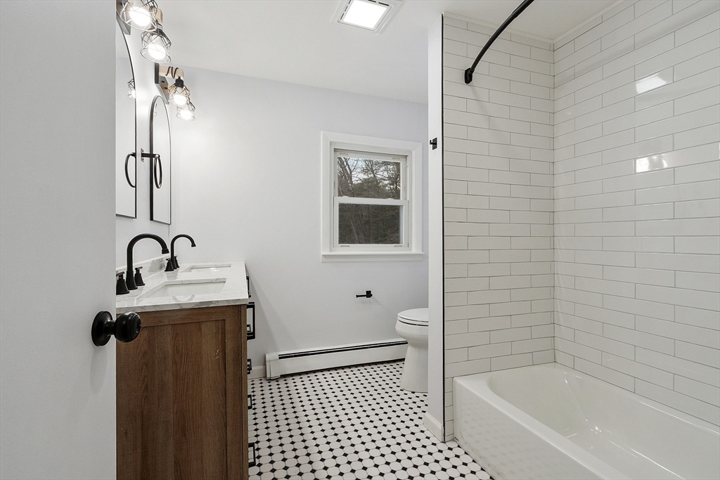 10 Townsend Road Shirley, MA 01464 - Photo 14 of 38 a bathroom with a sink a toilet and shower