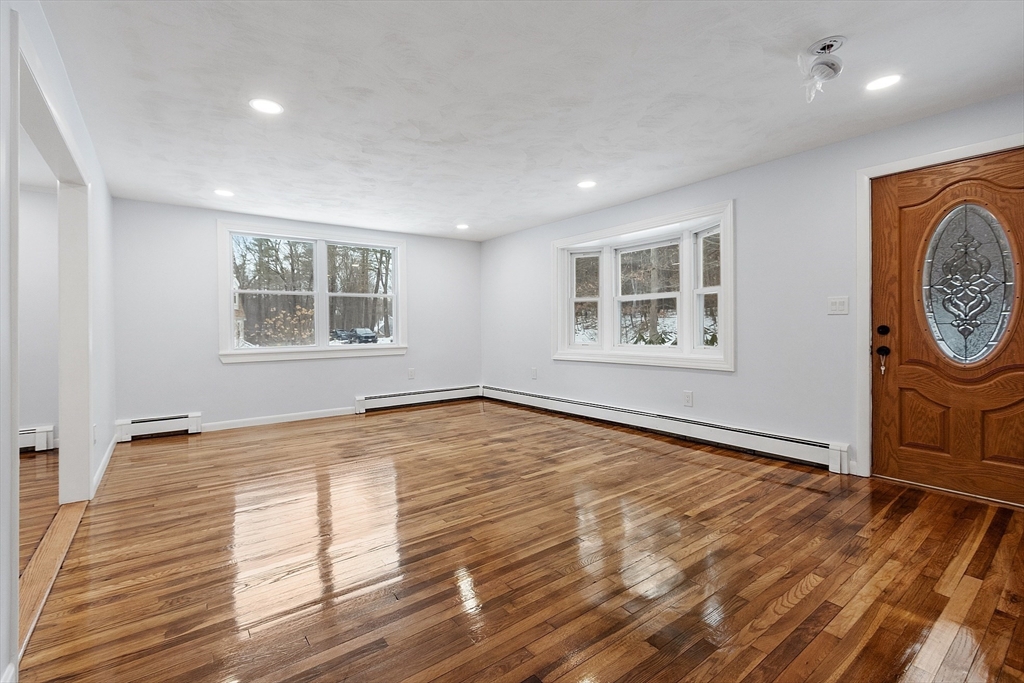 10 Townsend Road Shirley, MA 01464 - Photo 16 of 38 a view of empty room with wooden floor and fan