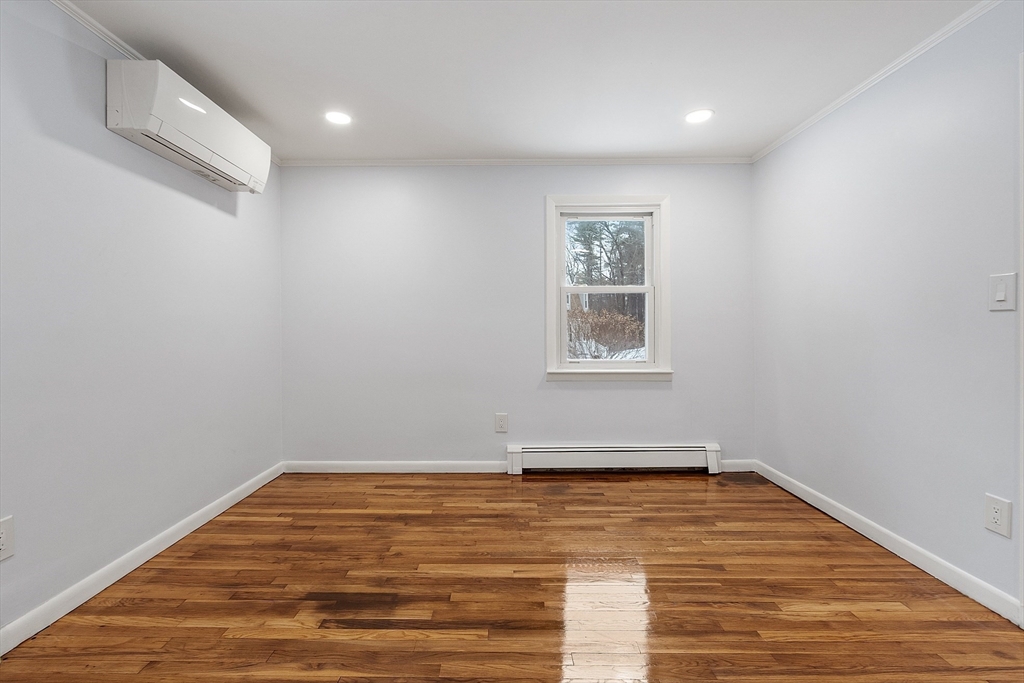 10 Townsend Road Shirley, MA 01464 - Photo 20 of 38 a view of empty room with wooden floor and fan