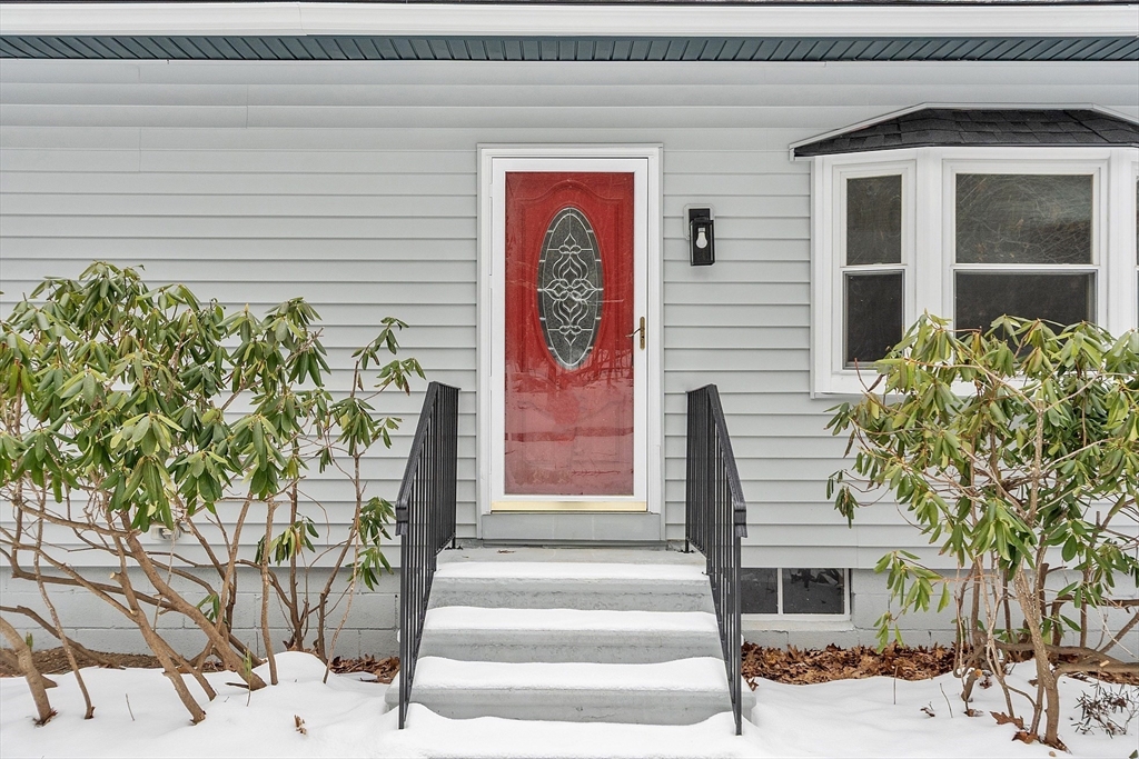 10 Townsend Road Shirley, MA 01464 - Photo 5 of 38 a front view of a house with potted plants