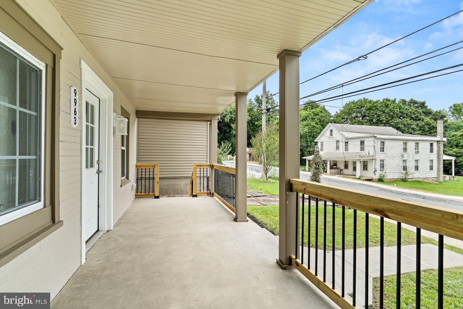 9963 Jonestown Road Grantville, PA 17028 - Photo 4 of 32 Charming porch with scenic neighborhood views.