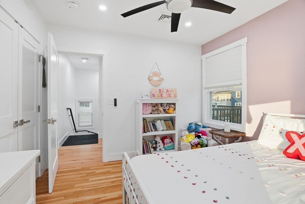 191 Court Road, Unit 3 Winthrop, MA 02152 - Photo 11 of 23 a bedroom with furniture and a book shelf