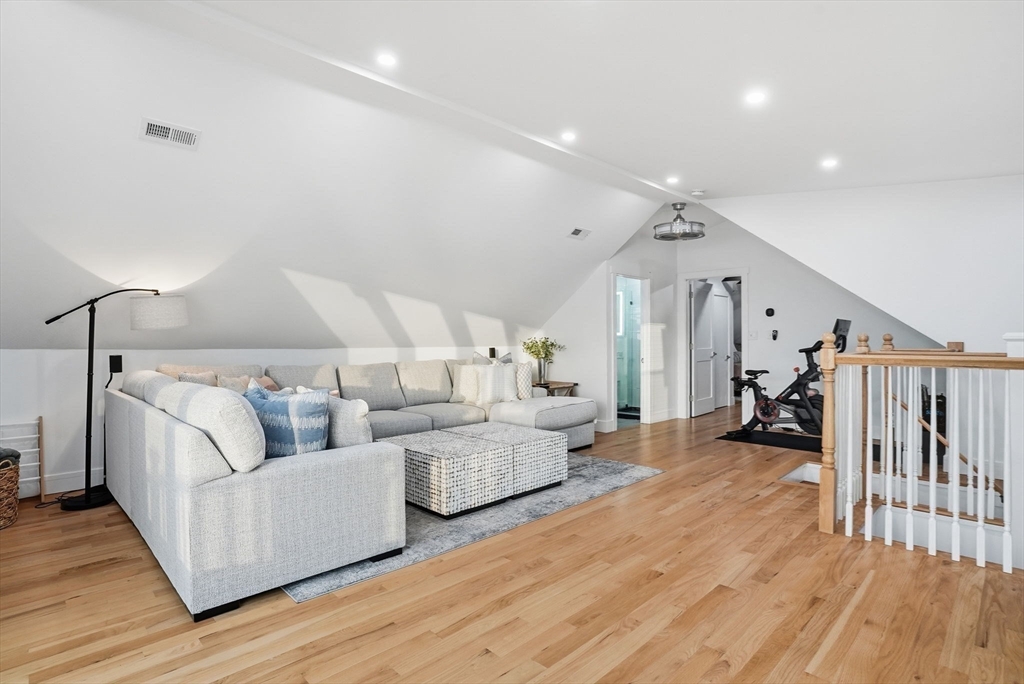 191 Court Road, Unit 3 Winthrop, MA 02152 - Photo 15 of 23 a living room with furniture and a wooden floor