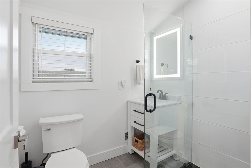 191 Court Road, Unit 3 Winthrop, MA 02152 - Photo 16 of 23 a bathroom with a shower a toilet and a window