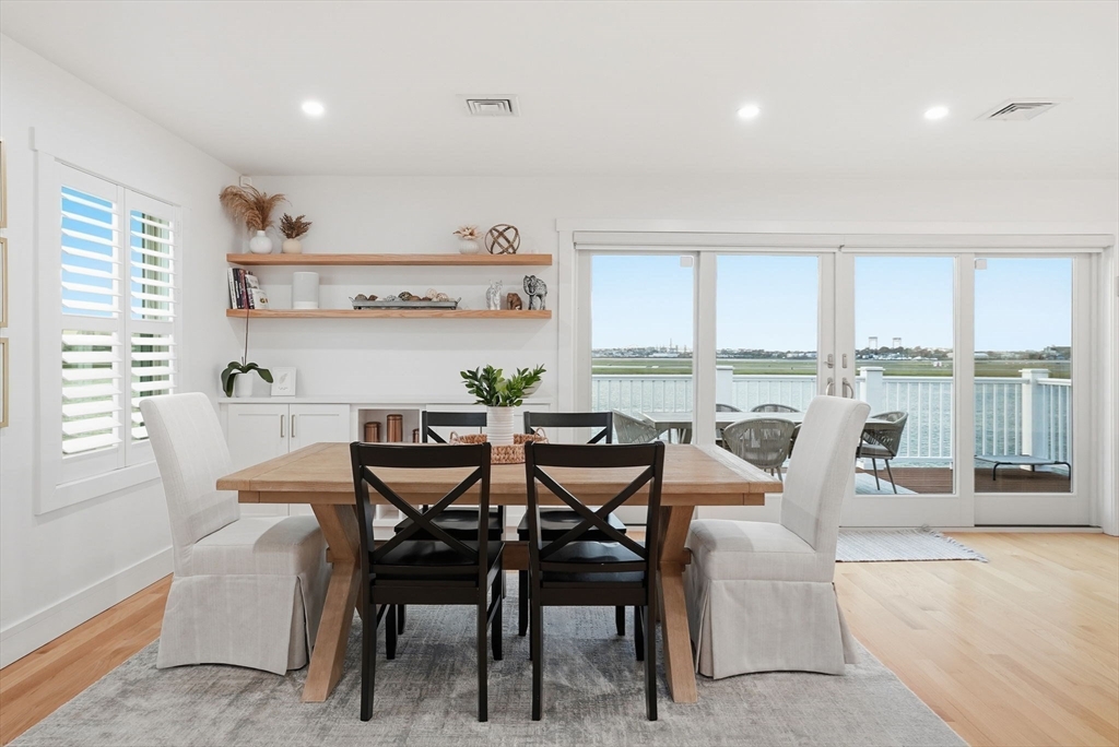 191 Court Road, Unit 3 Winthrop, MA 02152 - Photo 4 of 23 a dining room with furniture a rug and a large window