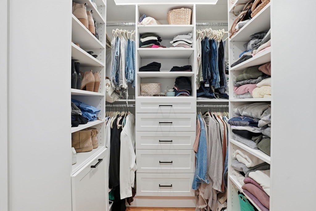 191 Court Road, Unit 3 Winthrop, MA 02152 - Photo 9 of 23 a view of walk in closet with clothes and shoes