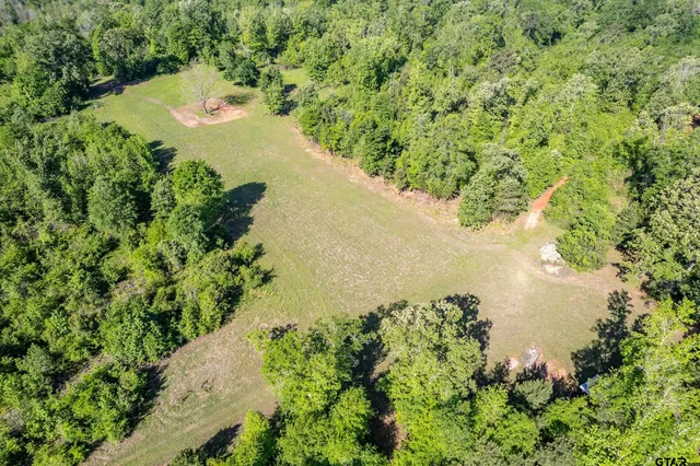 a view of a lake with a yard