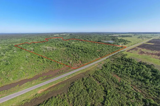 a view of a yard with an outdoor seating
