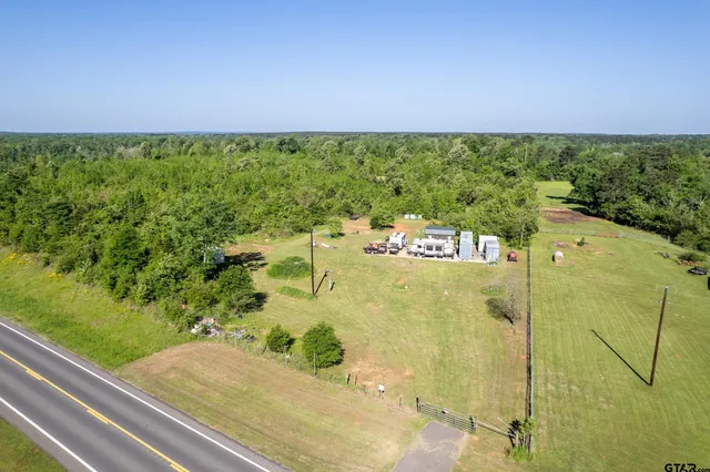 a view of a swimming pool with a yard