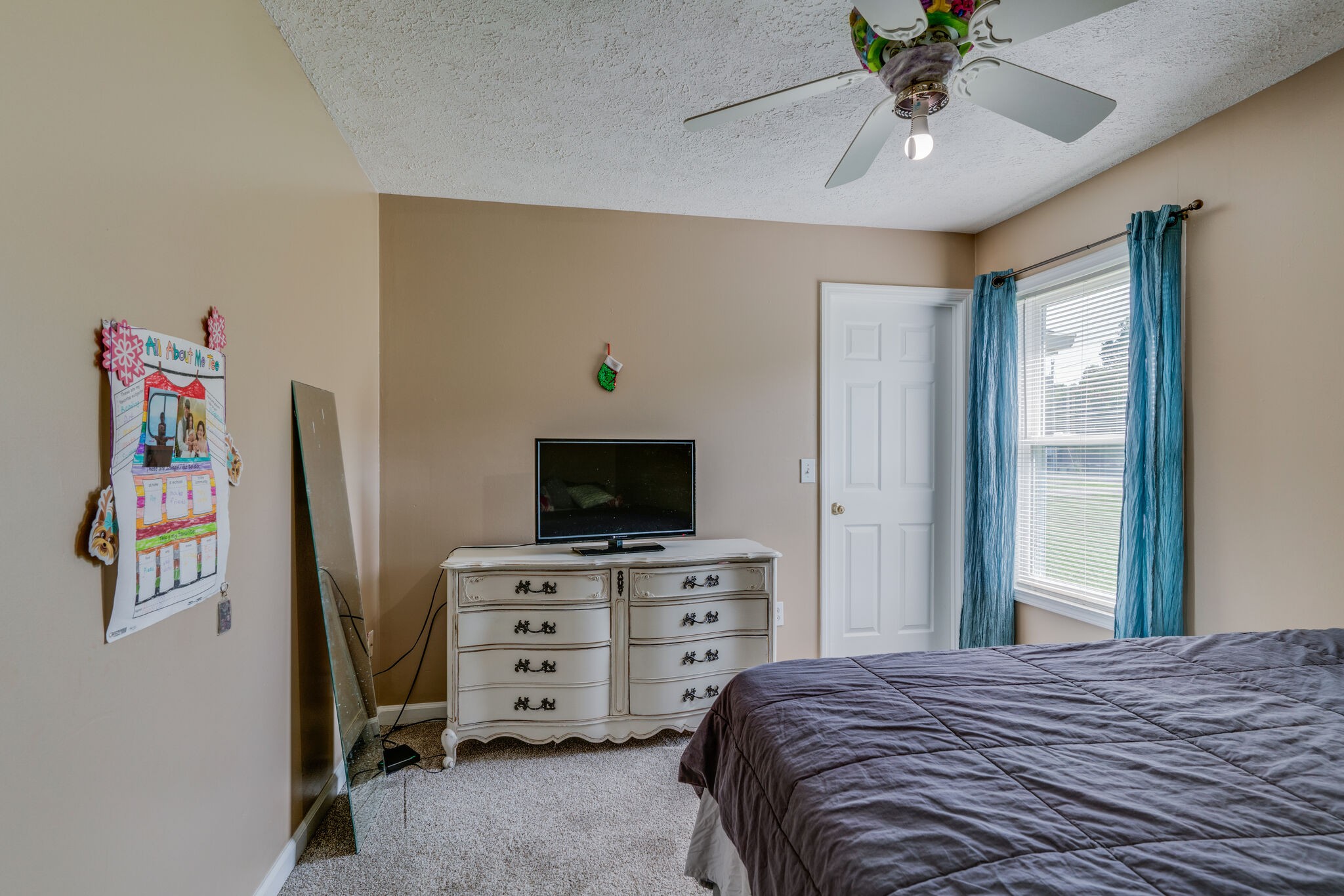 2755 Gideon Road Greenbrier, TN 37073 - Photo 14 of 30 a bedroom with a bed and a flat tv screen on dresser
