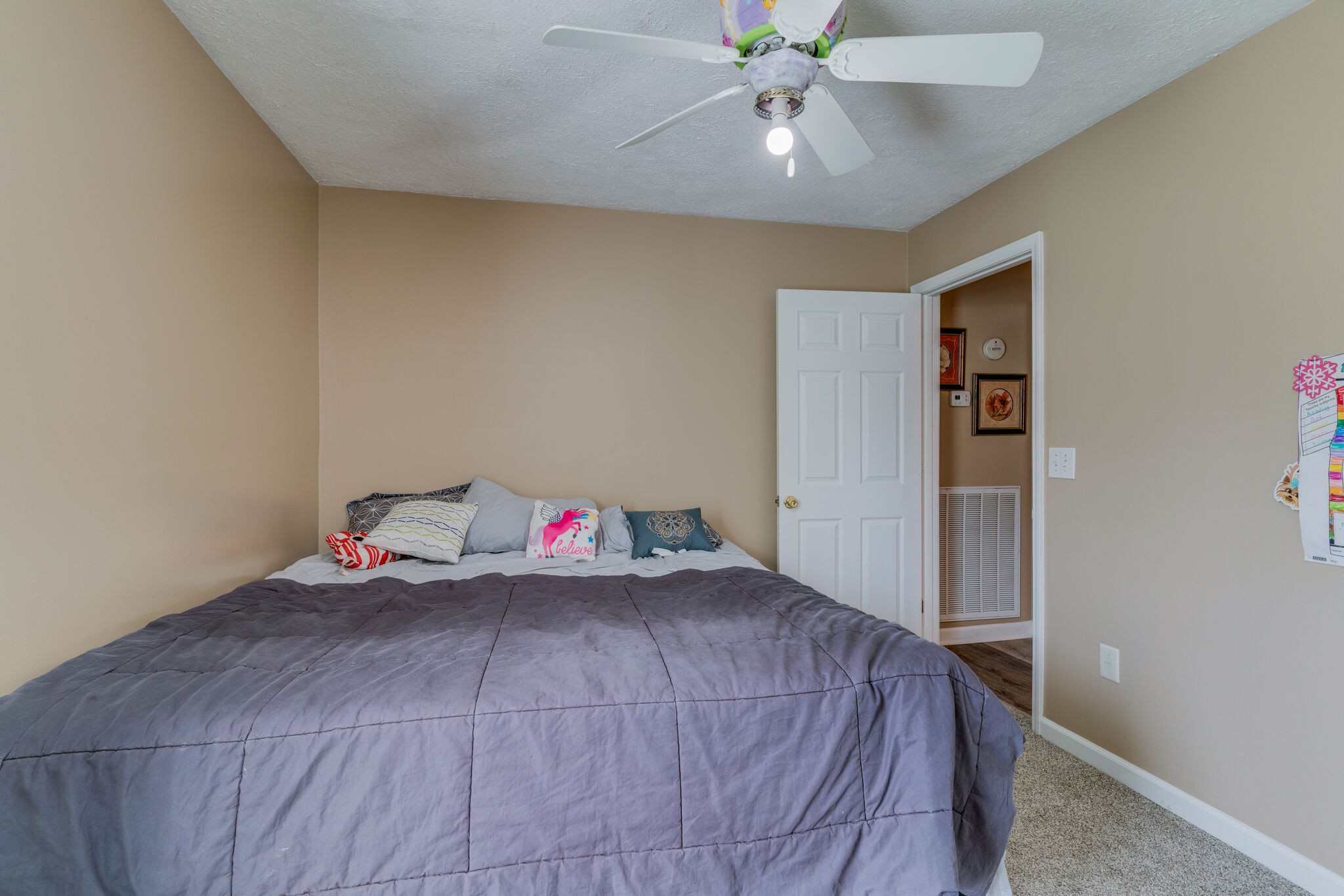 2755 Gideon Road Greenbrier, TN 37073 - Photo 15 of 30 a bedroom with a bed and a chandelier fan