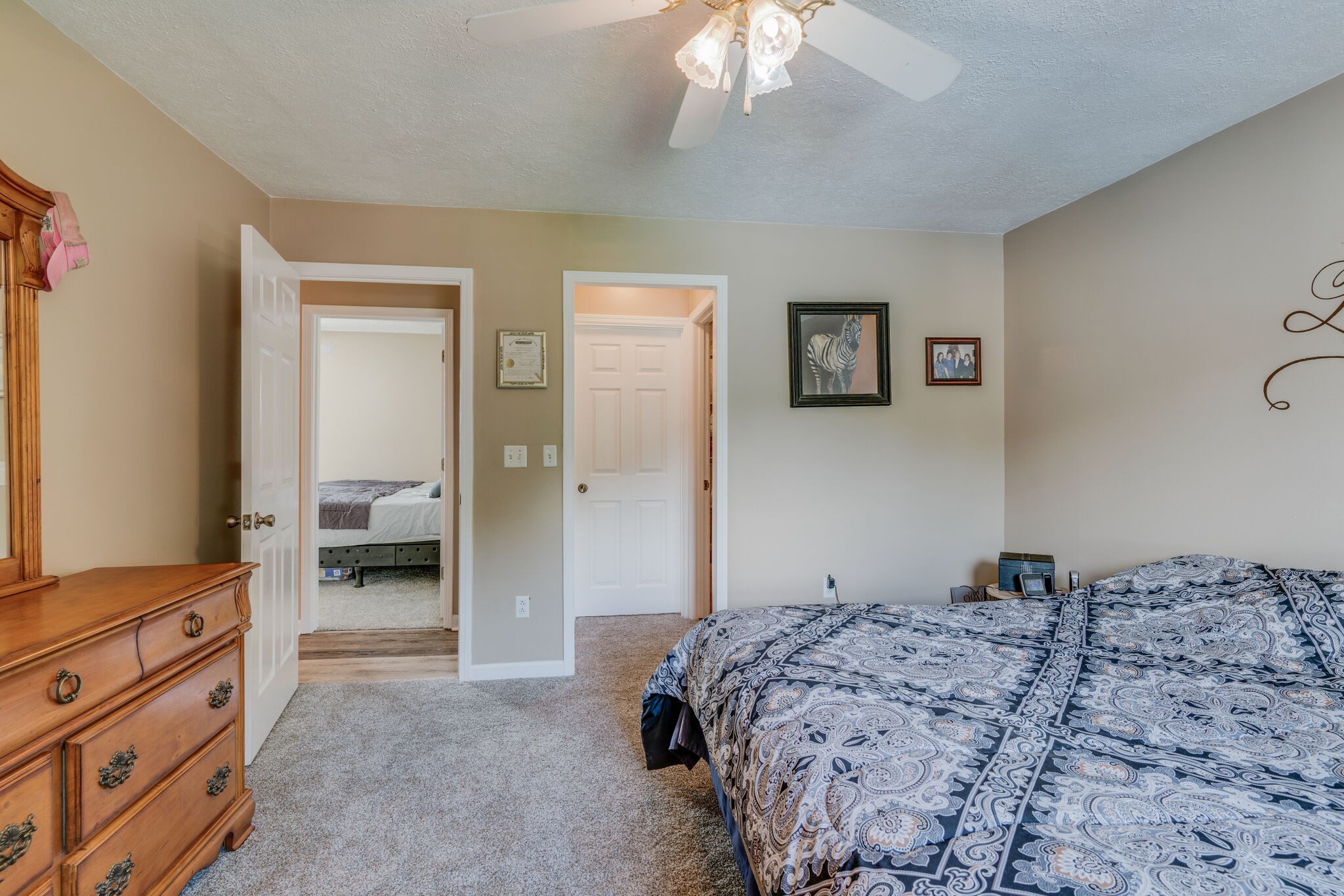 2755 Gideon Road Greenbrier, TN 37073 - Photo 18 of 30 a bedroom with a bed and a chandelier