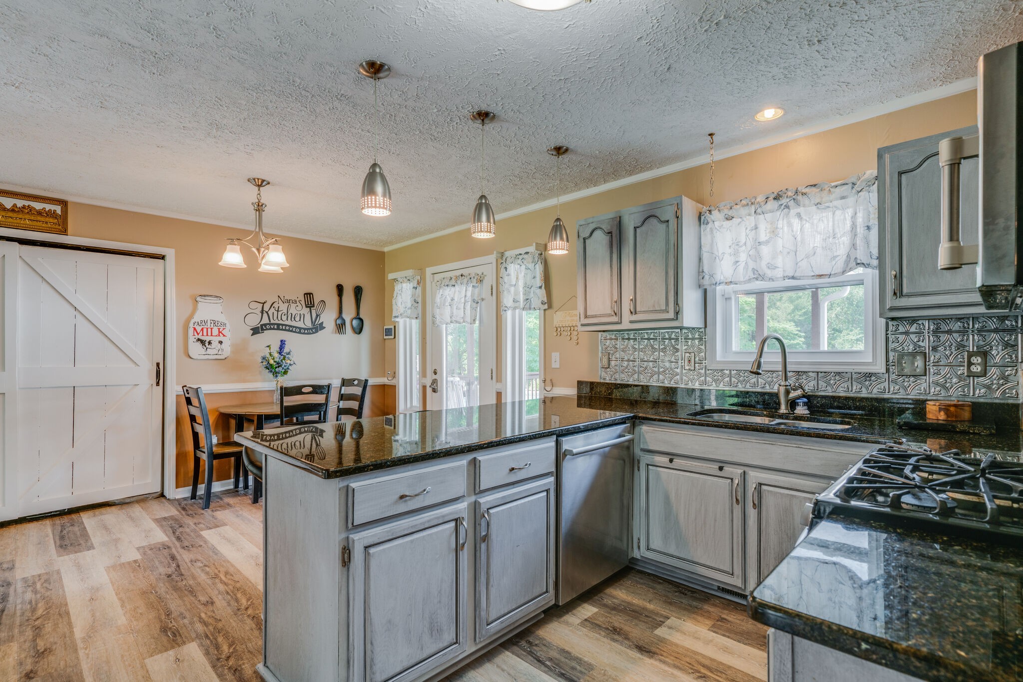 2755 Gideon Road Greenbrier, TN 37073 - Photo 9 of 30 a kitchen with a sink stove and cabinets