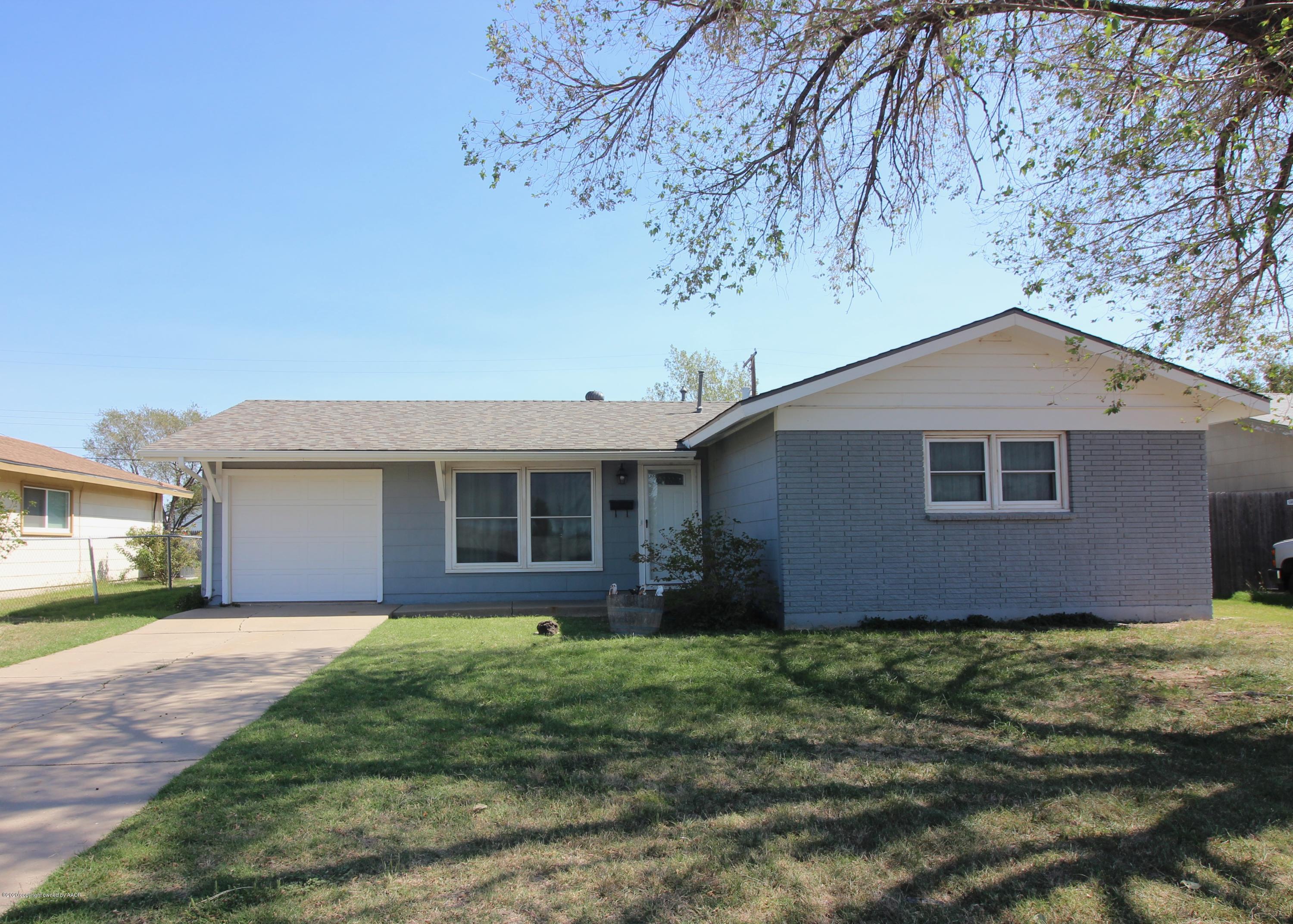 4307 South Fannin Street Amarillo, TX 79110 - Photo 1 of 3 a house that has a tree in front of it