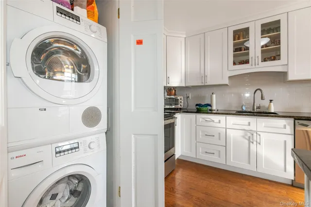 a kitchen with a washer and dryer in it