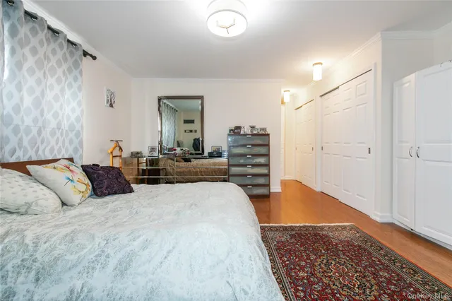 a bed room with a bed and dresser