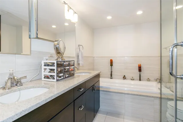 a bathroom with a sink double vanity and a mirror