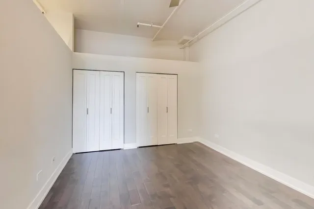 an empty room with wooden floor
