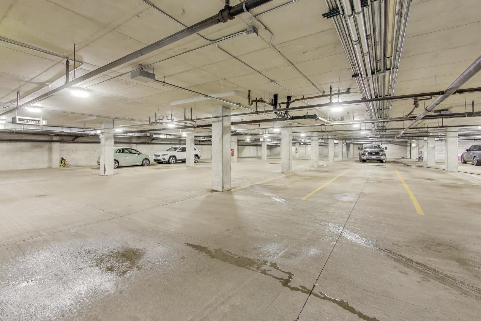 1301 West Madison Street, Unit 315 Chicago, IL 60607 - Photo 22 of 27 a view of parking garage with of a car
