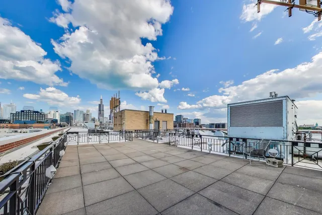 a view of a patio with dining table and chairs