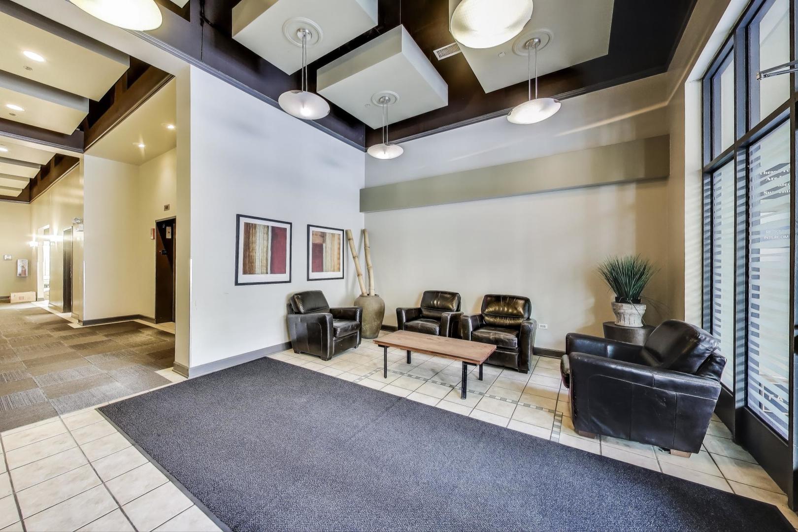 1301 West Madison Street, Unit 315 Chicago, IL 60607 - Photo 24 of 27 a living room with furniture