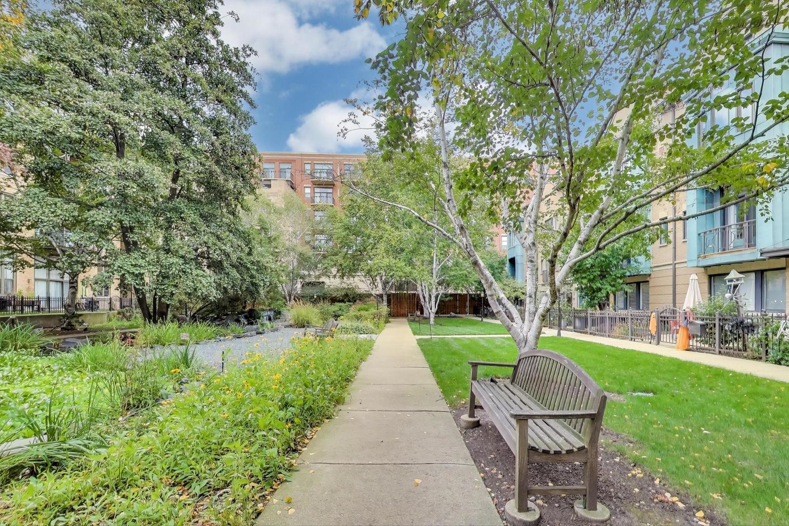 1301 West Madison Street, Unit 315 Chicago, IL 60607 - Photo 27 of 27 a view of a park with plants and large trees