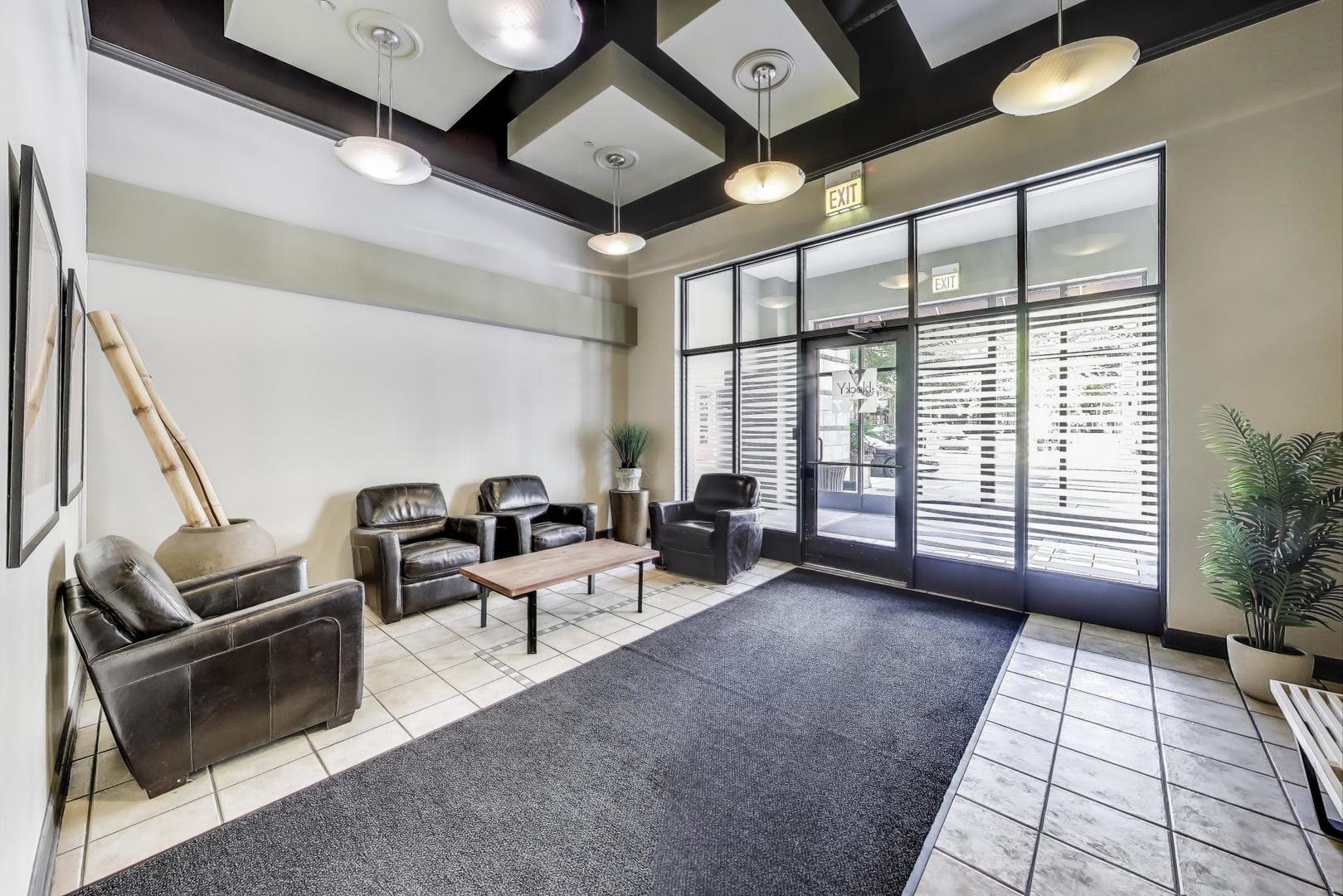 1301 West Madison Street, Unit 315 Chicago, IL 60607 - Photo 3 of 27 a living room with furniture and a large window
