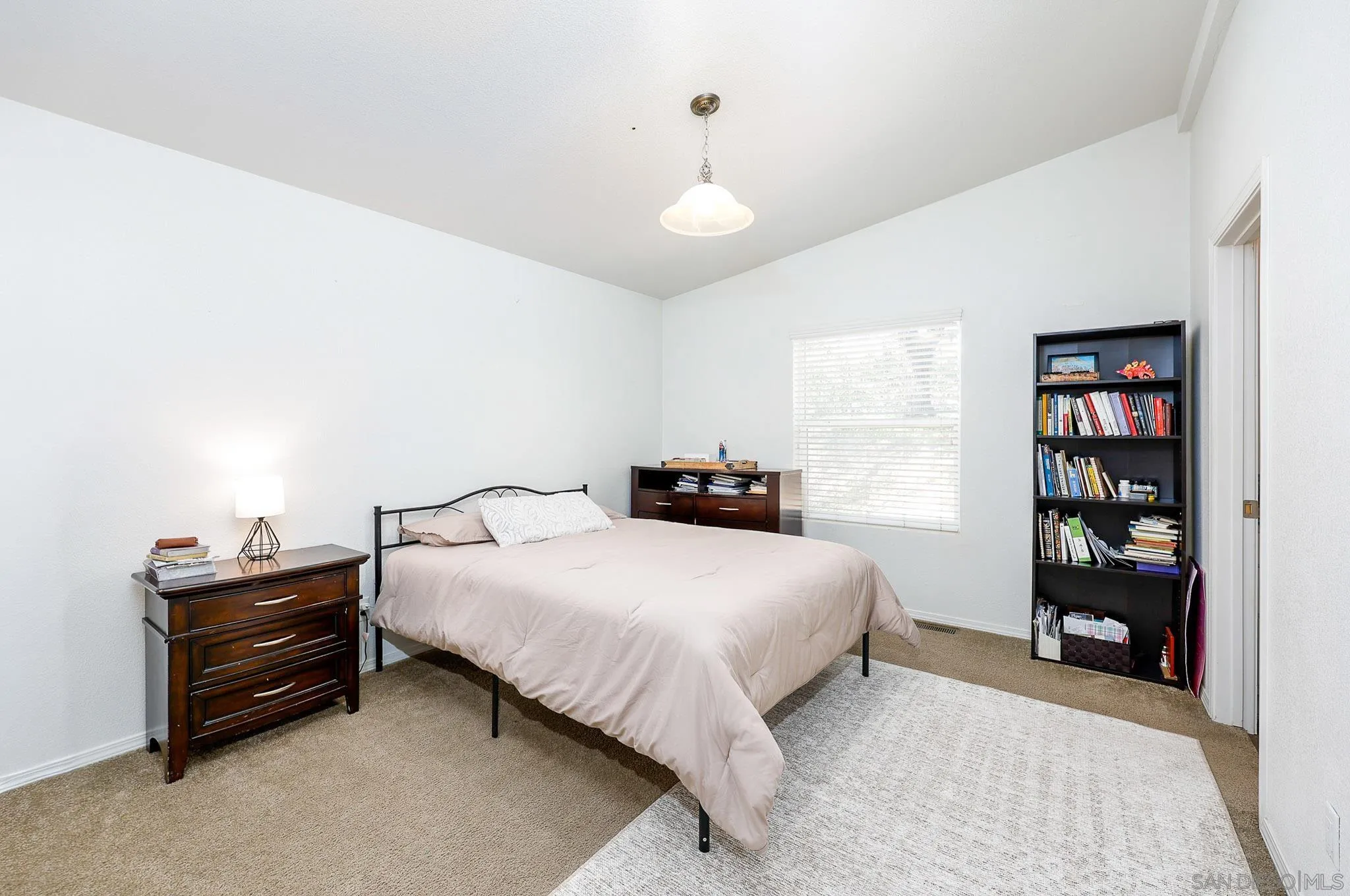 3505 Alpine Boulevard, Unit SPC 11 Alpine, CA 91901 - Photo 15 of 43 a bedroom with a bed and a book shelf