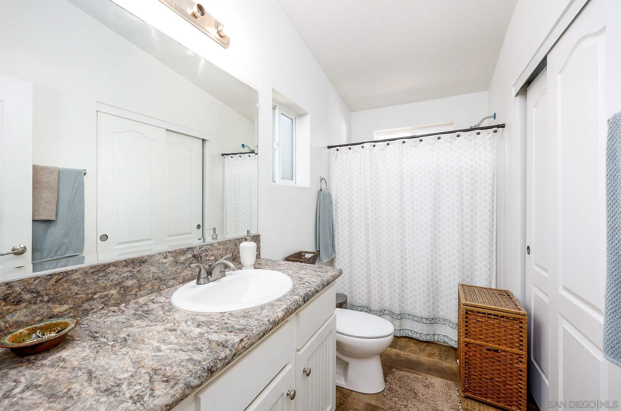 3505 Alpine Boulevard, Unit SPC 11 Alpine, CA 91901 - Photo 17 of 43 a bathroom with a granite countertop sink and a mirror