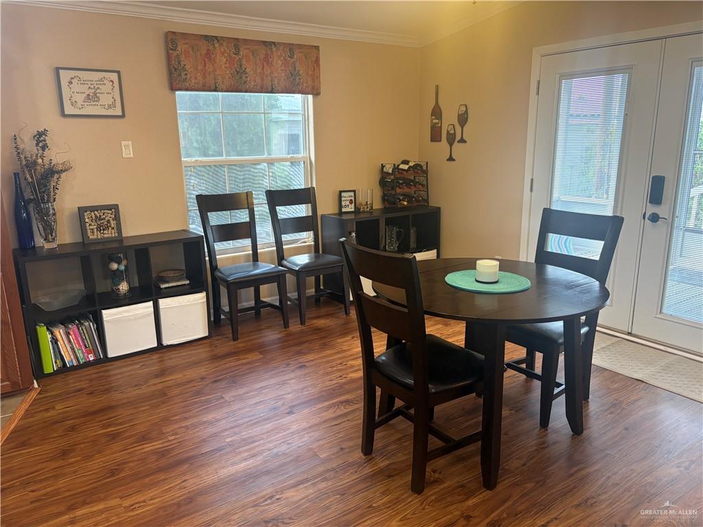 3078 Durango Street Mercedes, TX 78570 - Photo 16 of 41 a view of a dining room with furniture and wooden floor