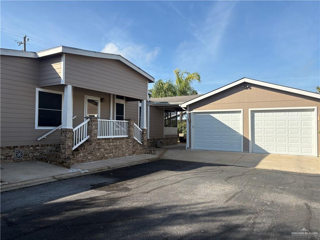 3078 Durango Street Mercedes, TX 78570 - Photo 2 of 41 a front view of house with yard