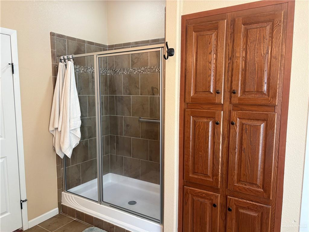 3078 Durango Street Mercedes, TX 78570 - Photo 23 of 41 a bathroom with a shower and a sink
