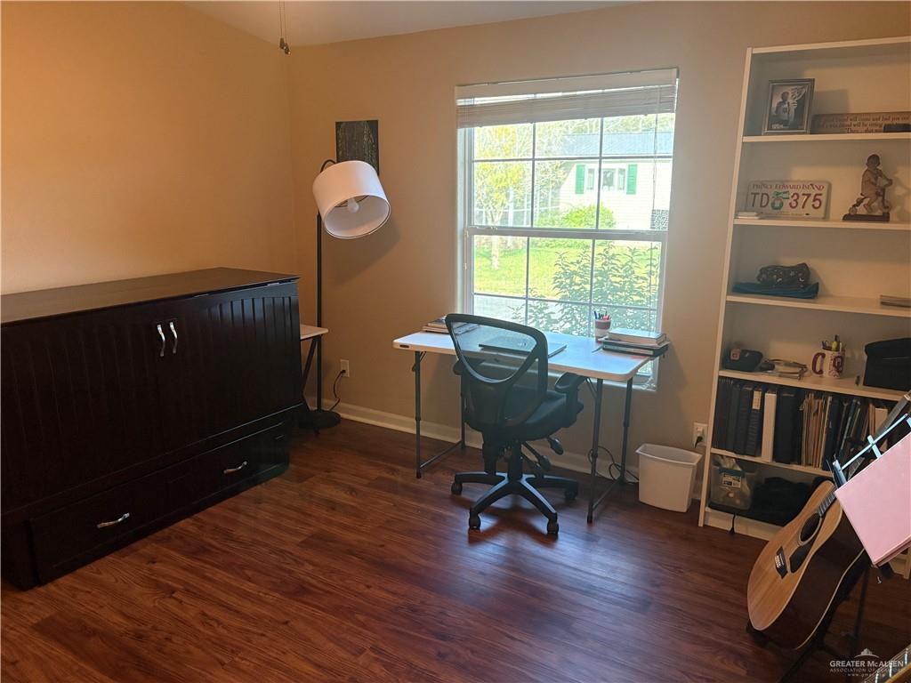 3078 Durango Street Mercedes, TX 78570 - Photo 27 of 41 a view of a workspace with furniture and a window
