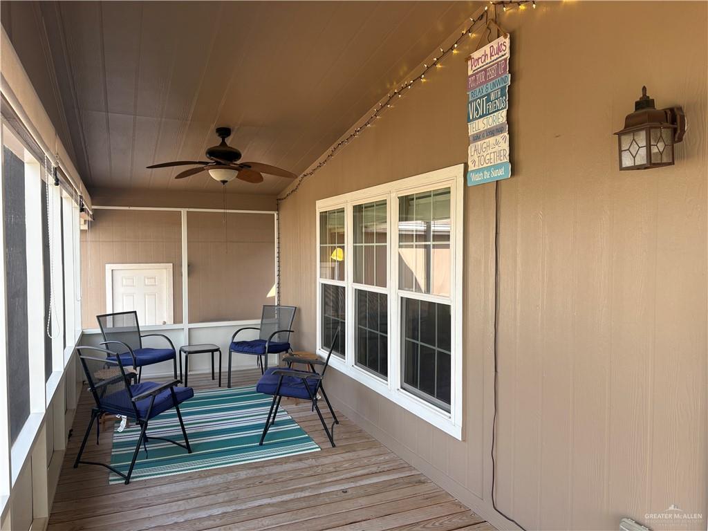 3078 Durango Street Mercedes, TX 78570 - Photo 34 of 41 a view of a dining room with furniture and wooden floor
