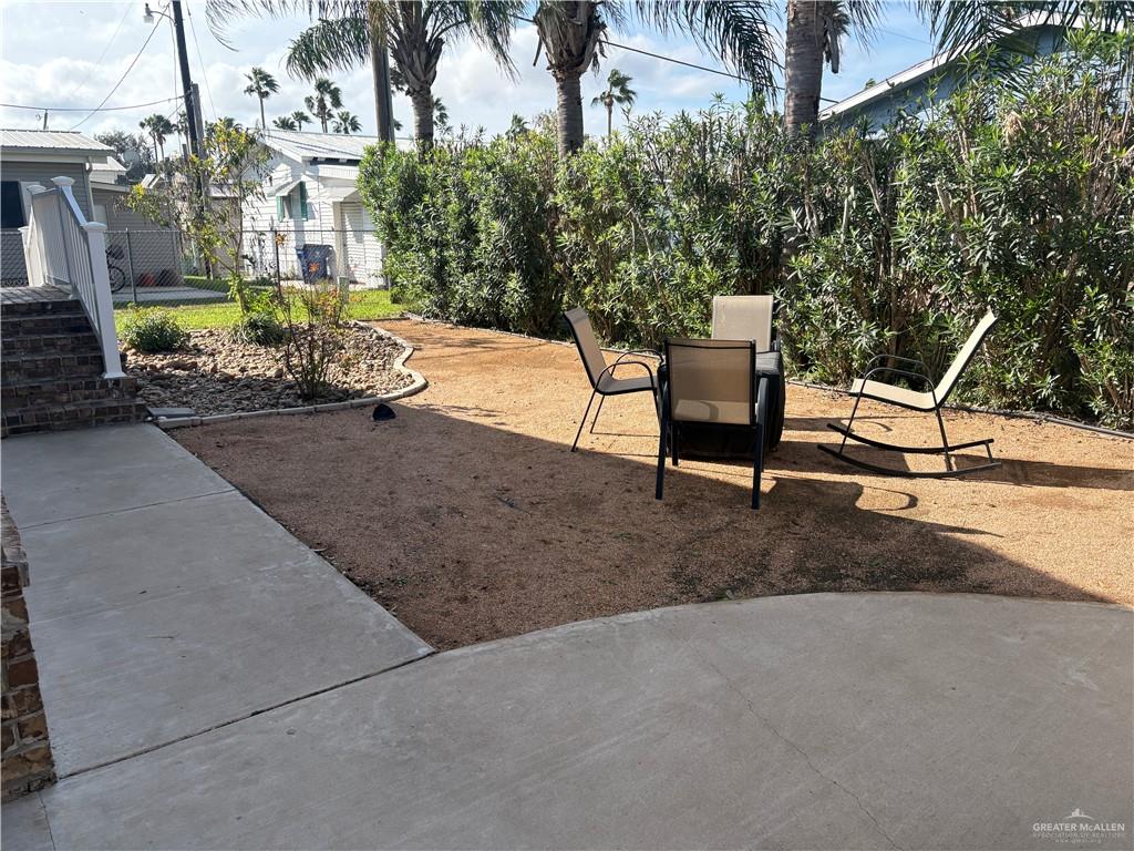 3078 Durango Street Mercedes, TX 78570 - Photo 5 of 41 a view of a park with plants and bench