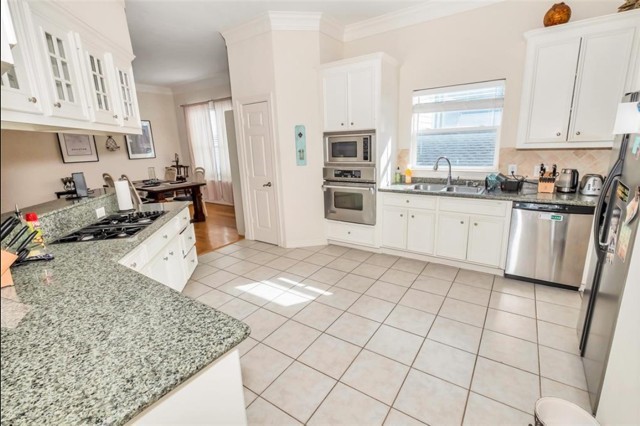 3011 Houston Avenue, Unit B Houston, TX 77009 - Photo 13 of 24 a kitchen with stainless steel appliances granite countertop a stove top oven a sink a counter space and cabinets