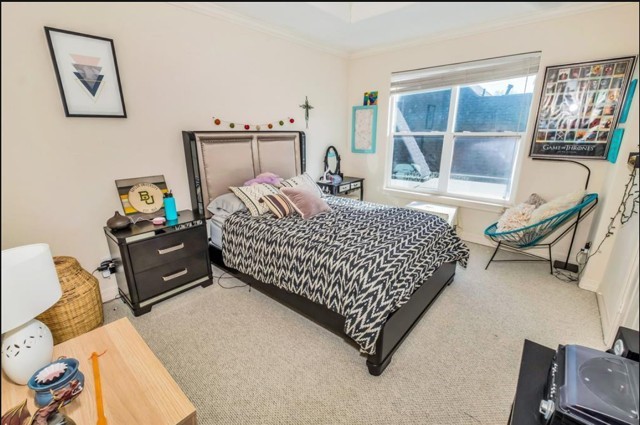 3011 Houston Avenue, Unit B Houston, TX 77009 - Photo 22 of 24 a bed room with a bed and a chair