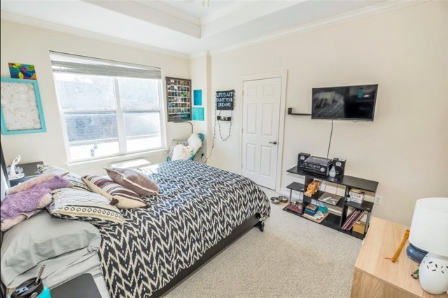 3011 Houston Avenue, Unit B Houston, TX 77009 - Photo 23 of 24 a bedroom with a bed and a window
