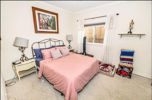 3011 Houston Avenue, Unit B Houston, TX 77009 - Photo 4 of 24 a bedroom with bed and a window