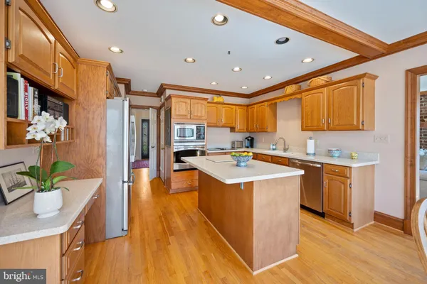 a kitchen with stainless steel appliances granite countertop a sink and cabinets