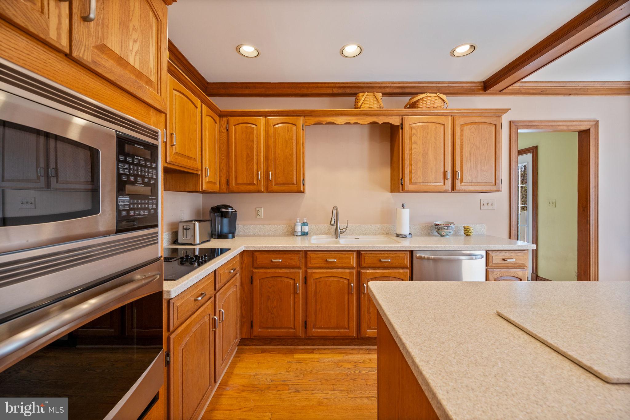 12 Sparks Station Road Sparks Glencoe, MD 21152 - Photo 14 of 57 a kitchen with stainless steel appliances granite countertop a sink and cabinets