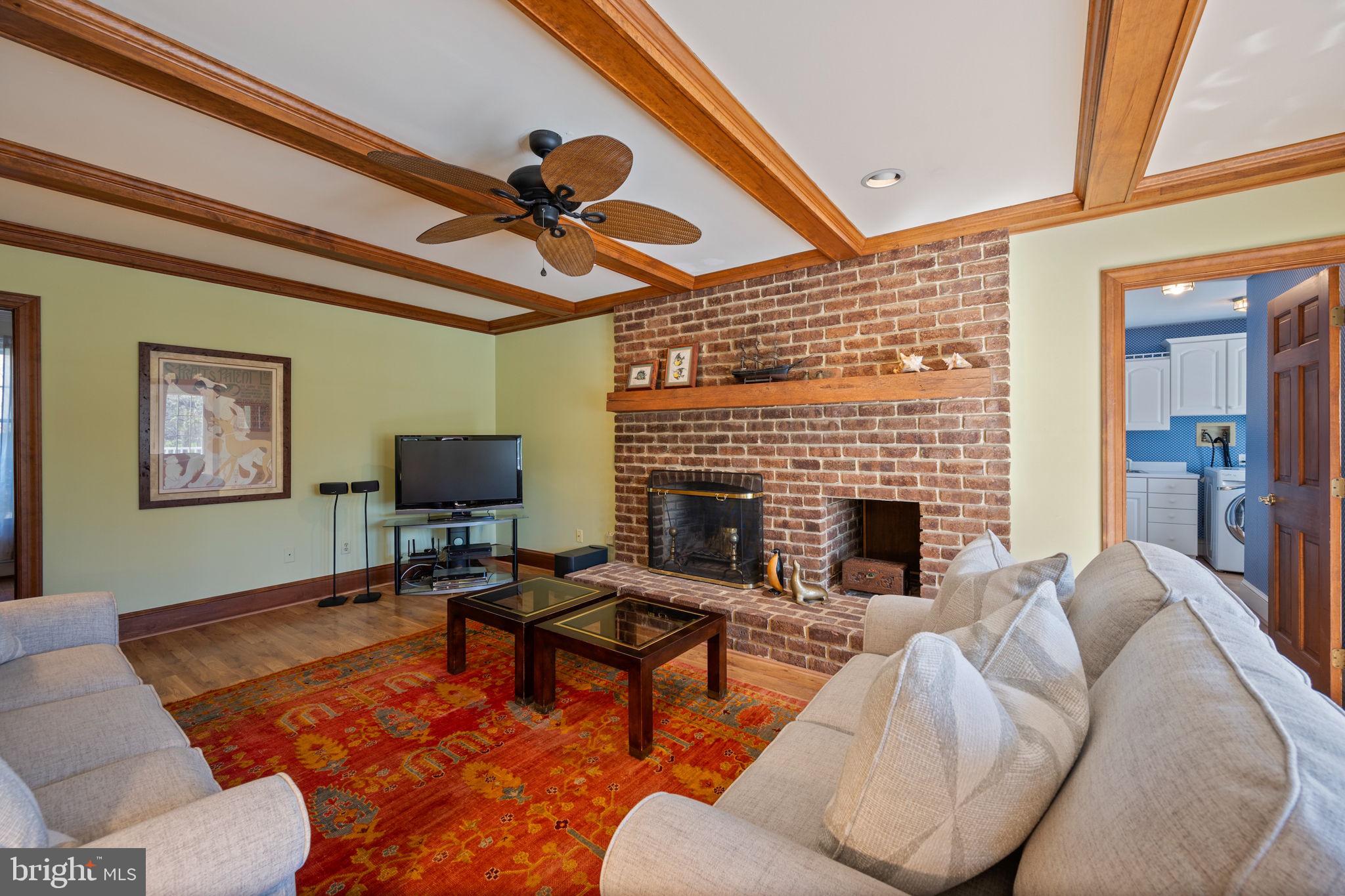 12 Sparks Station Road Sparks Glencoe, MD 21152 - Photo 17 of 57 a living room with furniture a fireplace and a flat screen tv