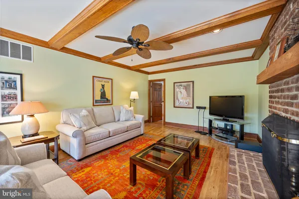 a living room with furniture cabinets and a book shelf