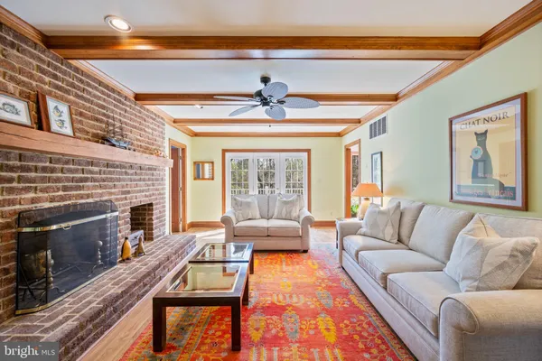 a bathroom with a sink a toilet and a window