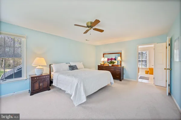 a white bath tub sitting next to a white toilet